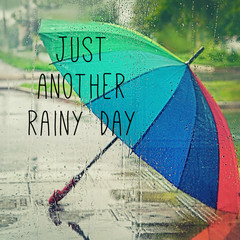 just another rainy day - inspiration quote. colorful umbrella in rainy weather. Rainbow umbrella,...