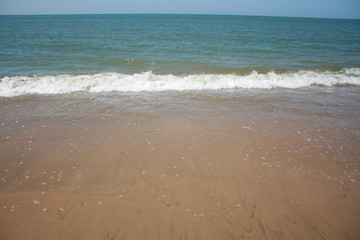 Fototapeta na wymiar Spanish beach , water with waves at summer