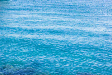 simple natural background of calm blue smooth sea water surface 