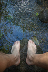 Naked man feet in the wild