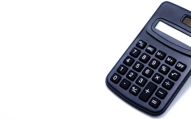 Black calculator placed isolated on a white background.Copy space.