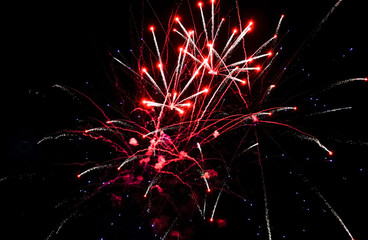 Colorful fireworks in the sky on black background. Celebratory salute, fireworks