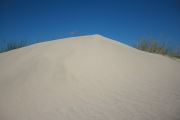 Spanish beach with golden sun and blue sky Huelva