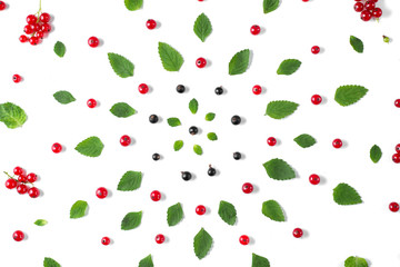 Fruit pattern made of fresh berries and green leaves on white background. Concept of healthy food. Flat lay, top view, copy space