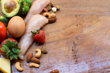 Keto ingredients on wood background