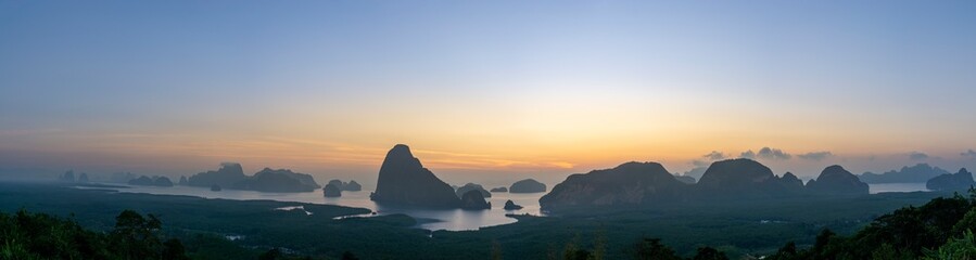 Panorama Morning sunrise. Mountains in the Andaman Sea. March 2019: Samed Nang Phi Phang Nga, Thailand