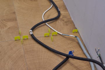 wood effect tiles on the floor. unfinished laying floor tiles