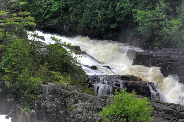 Fototapeta na wymiar Small waterfall with motion in the wilderness