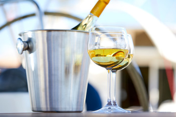 Pair of wineglasses against the yacht