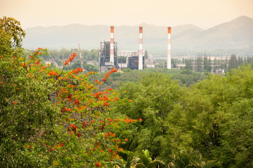 Obraz premium High angle view of an old coal mine with pipes in a valley.