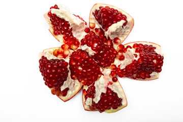 Juicy ripe pomegranate on white background. Pomegranate seeds