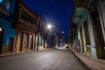 Street view of the residential neighborhood in the Old Havana City, Capital of Cuba, during night time after sunset.