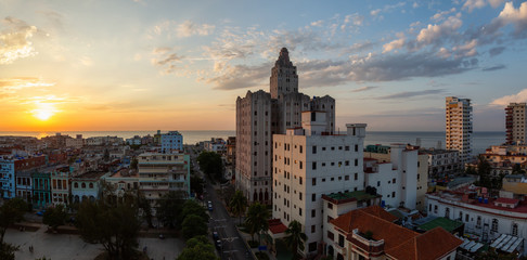Aerial Panoramic view of the Havana City, Capital of Cuba, during a colorful cloudy sunset.