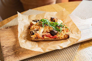 slice of italian pizza in the pizzeria