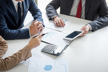 Group of partner working conversation, Business team meeting present with investor colleagues discussing plan financial graph data and analyzing strategy to growth up to profit into company