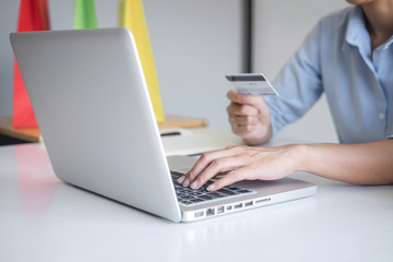 Woman using credit card register security code and payments online shopping and customer service network connection market, using on laptop, Internet Online shopping or internet banking concept