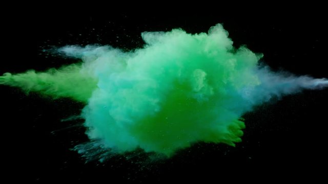 Super slow motion of coloured powder collision isolated on black background. Filmed on high speed cinema camera, 1000fps.