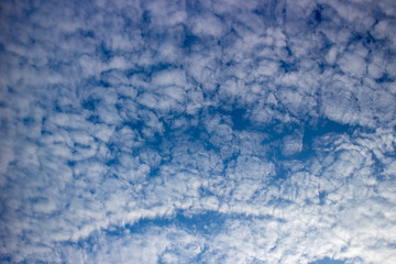 Blue sky with white clouds closeup. With copy space.