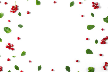 Fruit pattern made of fresh berries, green leaves and frame on white background. Concept of healthy food. Flat lay, top view, copy space