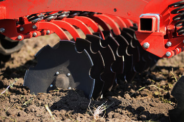 Agricultural plow close-up on the ground, agricultural machinery.