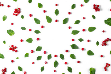 Fruit pattern made of fresh berries, green leaves and frame on white background. Concept of healthy food. Flat lay, top view, copy space