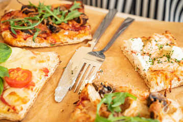 woman eating pizza in the restaurant