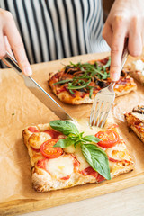 woman eating pizza in the restaurant