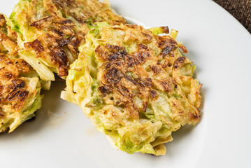 vegetable pancakes on the white plate