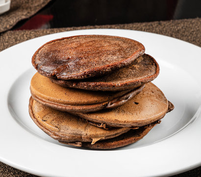 chocolate pancakes on the white plate