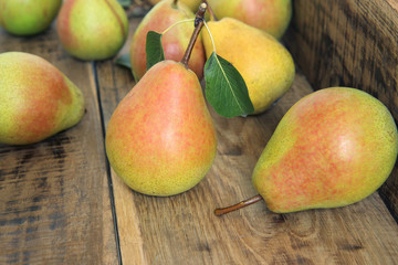 ripe pears on a wooden table