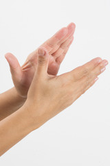 Close-up of a woman's hand and finger on white background