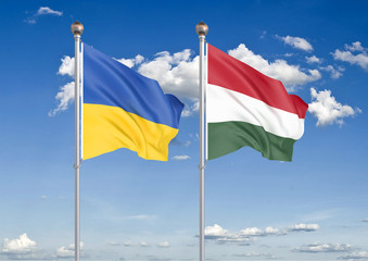 Ukraine vs Hungary. Thick colored silky flags of Ukraine and Hungary. 3D illustration on sky background. – Illustration