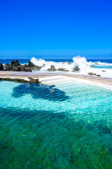Natural volcanic swimming lagoon pools at Porto Moniz, travel destination for vacation, Madeira...