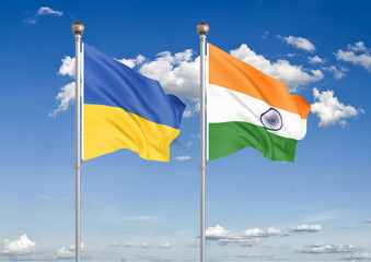 Ukraine vs India. Thick colored silky flags of Ukraine and India. 3D illustration on sky background. – Illustration