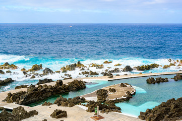 Natural volcanic swimming lagoon pools at Porto Moniz, travel destination for vacation, Madeira island, Portugal