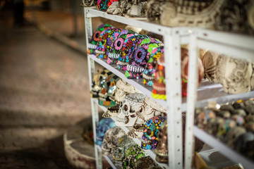 Mexican souvenirs in the shop. Colorful skulls 