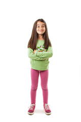 Portrait of a cute little girl standing with folded hands. Isolated on white background