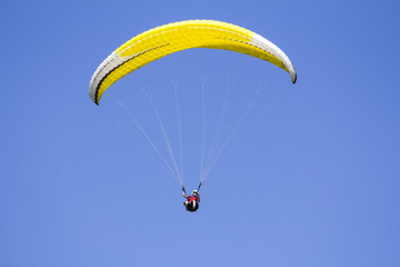 Paragliding in the blue sky as background extreme sport