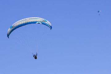 Paragliding in the blue sky as background extreme sport