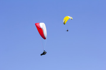 Fototapeta na wymiar Paragliding in the blue sky as background extreme sport