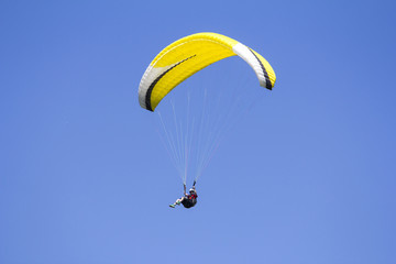 Paragliding in the blue sky as background extreme sport