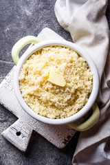 Couscous with butter in pot