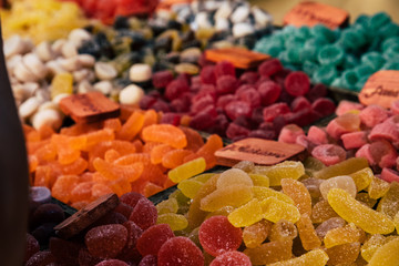 Colorful sugar sweets gums and jelly beans on market