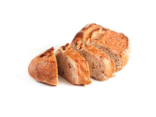 Loaf of whole wheat bread with slices isolated on white background