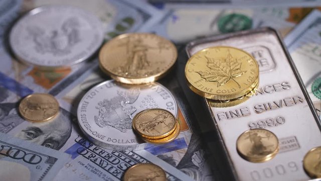 Focus on stack of Money, silver and gold coins