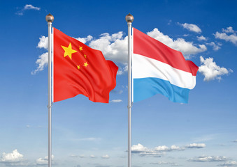 China vs Luxembourg. Thick colored silky flags of European Union and Belgium. 3D illustration on sky background. – Illustration