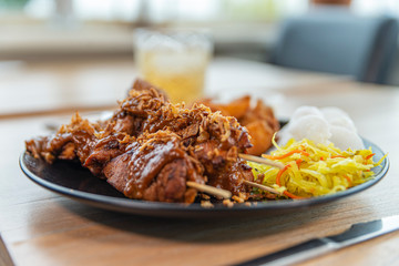 Plate saté menu with potatos from right
