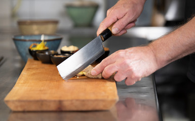 Cutting chicken for homemade saté