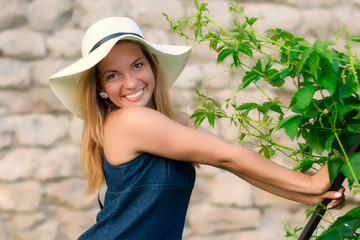Young beautiful young sexy sporty girl with naughty smile outside in summer.