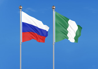 Russia vs Nigeria. Thick colored silky flags of Russia and Nigeria. 3D illustration on sky background. – Illustration